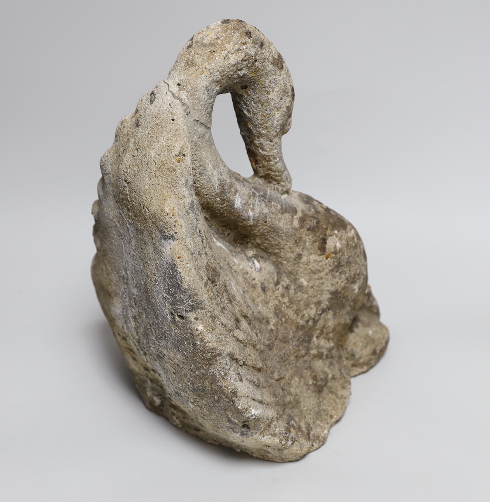 A reconstituted stone model of a swan, 30cm
